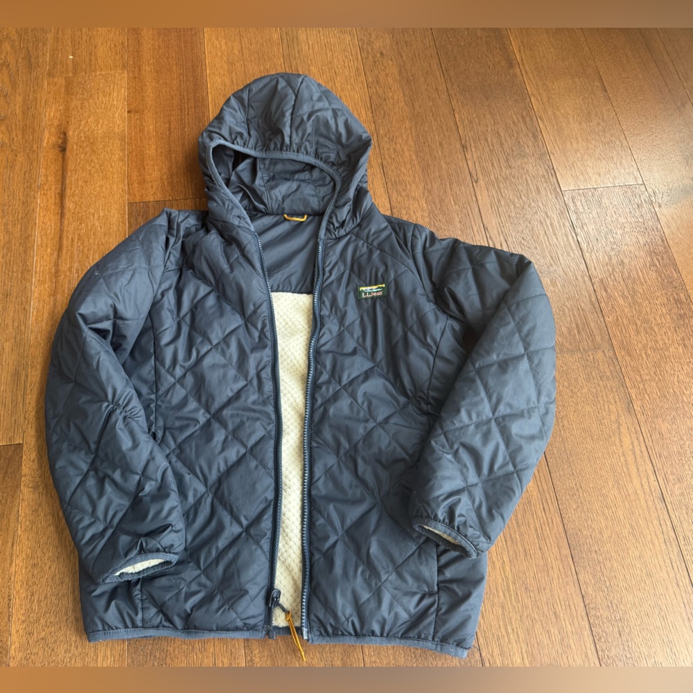 LL Bean quilted hooded jacket in navy with sherpa lining. Size 10-12.Gently used